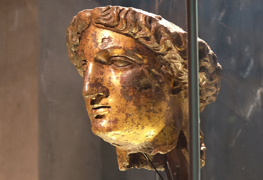 The gilt bronze head of the goddess Sulis Minerva, one of the priceless finds you'll see at the Roman Baths