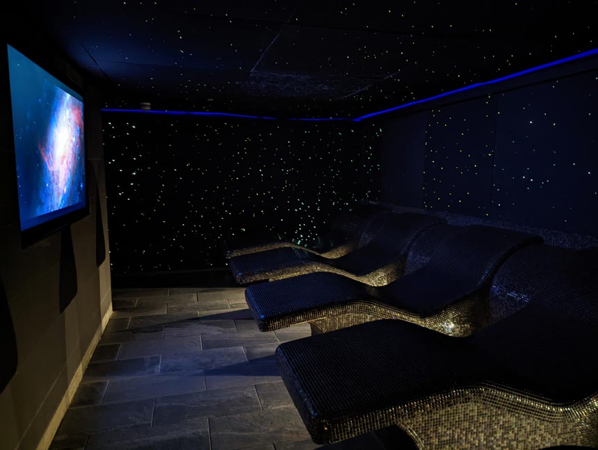The Celestial Relaxation room is space themed, with gently warmed loungers and sparkly stars all around you