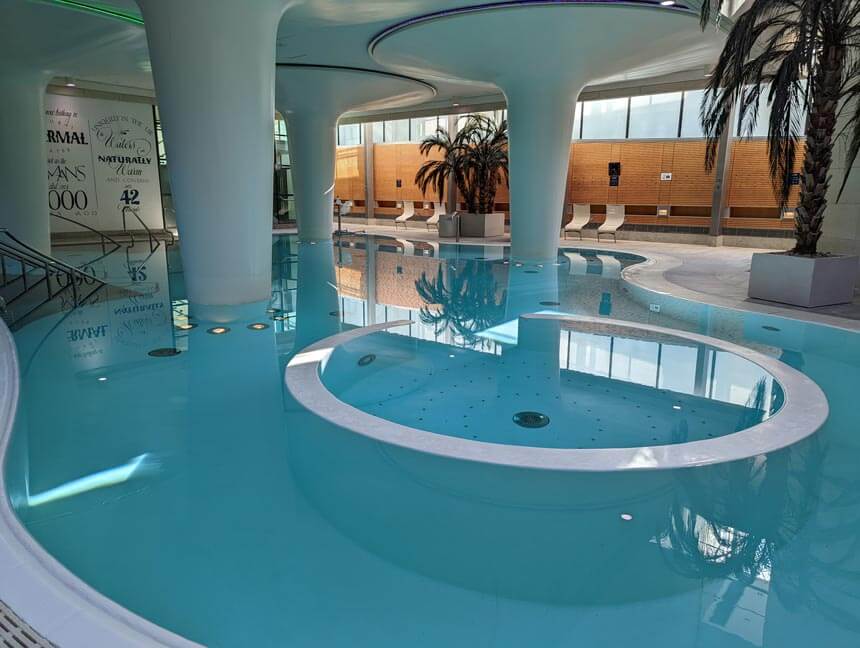 The large Minerva pool is filled with naturally warm thermal water from Bath's hot springs
