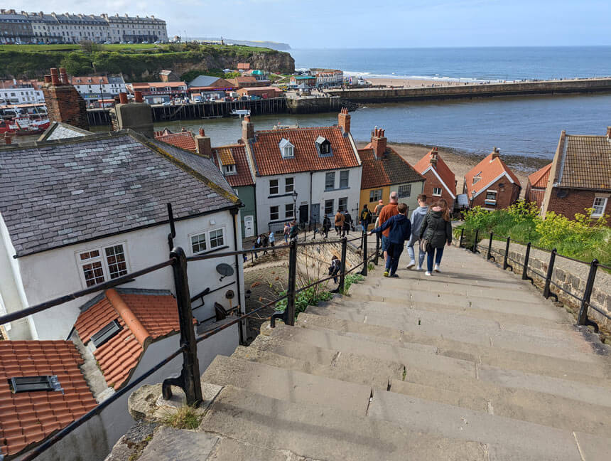 The 199 steps in Whitby lead from the town up to Whitby Abbey. Climbing the steps and seeing the lovely views is one of the best things to do in Whitby.