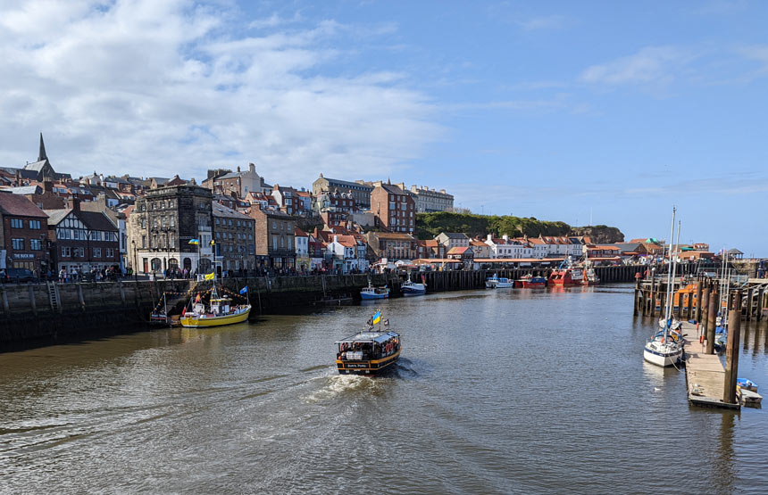 A boat trip leaving Whitby harbour