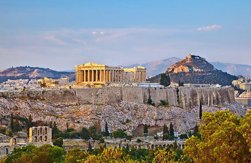 The Acropolis in Athens, with Lycabettus Hill behind. While the Acropolis is closed on many public holidays in Athens, the viewpoint and funicular at Lycabettus Hill is open every day of the year.