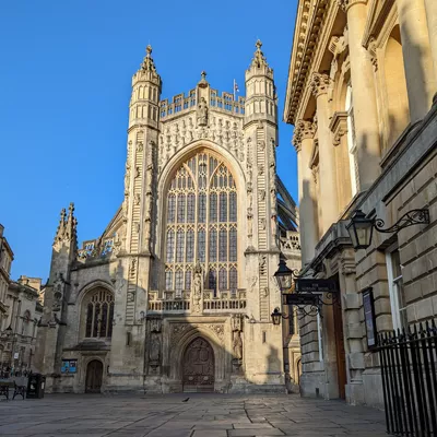 Gothic stone facade of Bath Abbey in Bath, UK