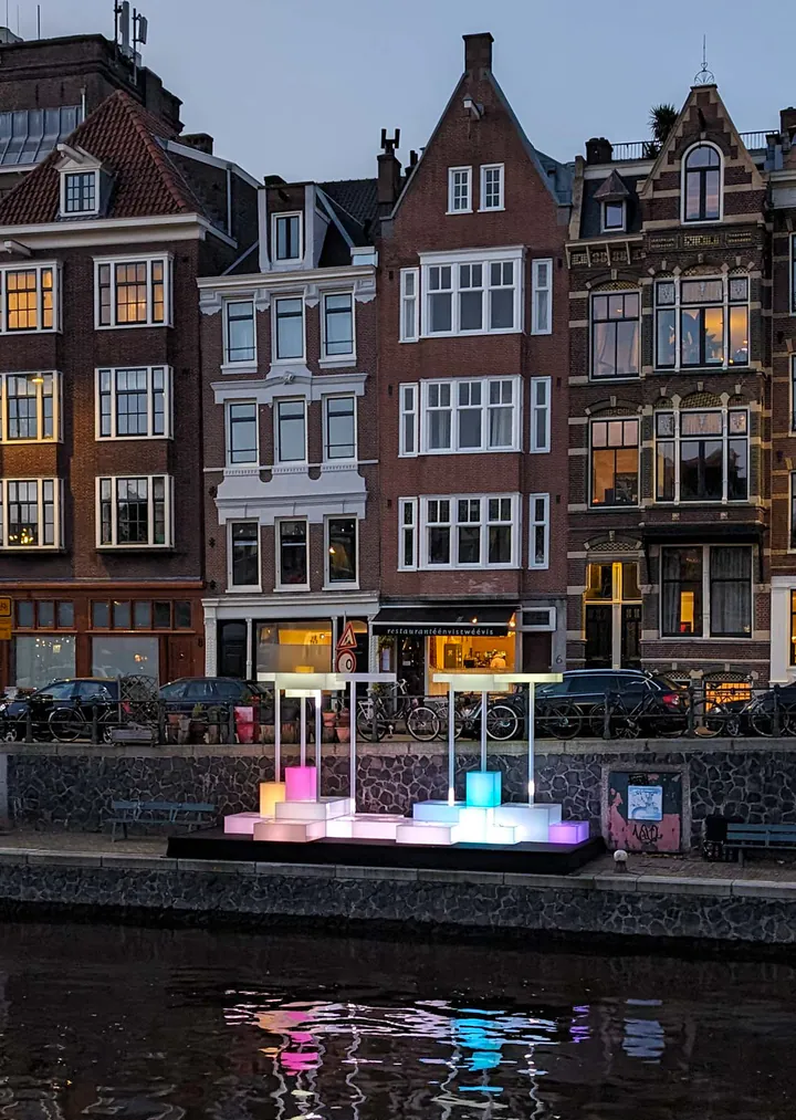 Chromatic Rain by Joan Giner. The lights of the Amsterdam Light Festival come on in the early evening.