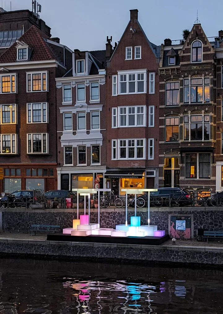 Chromatic Rain by Joan Giner. The lights of the Amsterdam Light Festival come on in the early evening.