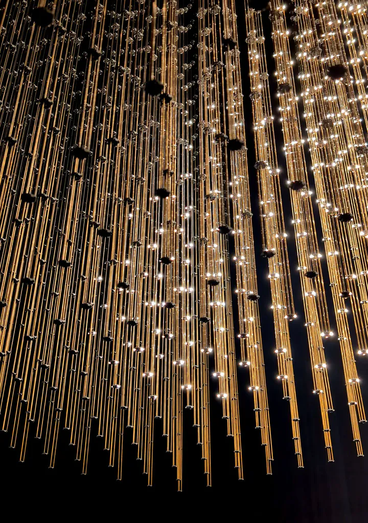 The Swam Study XIII artwork by Random International. Columns of flickering lights hang from the ceiling.