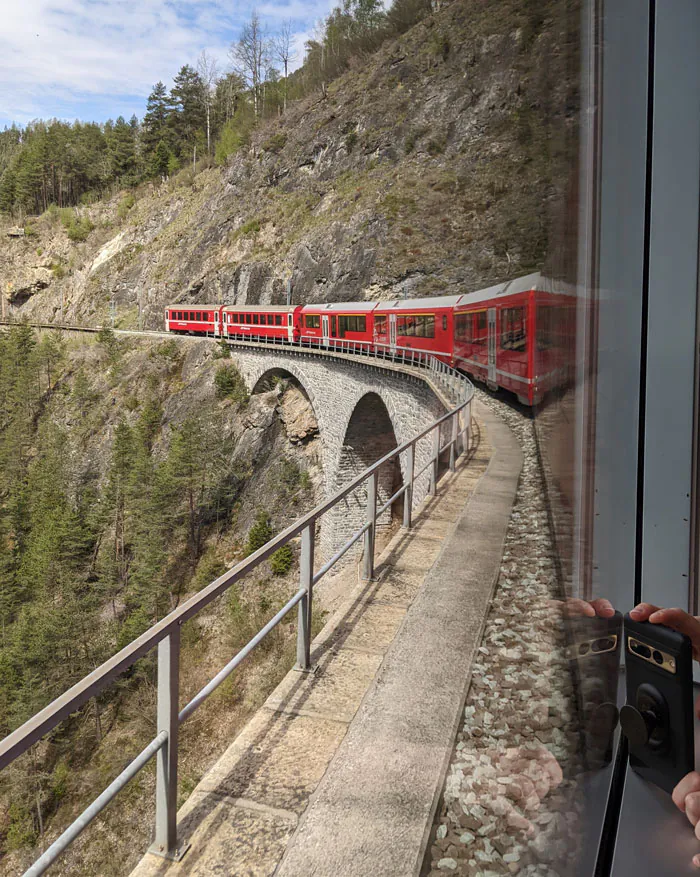 My partner took this photo of the train going across the Landwasser Viaduct. My photos looking the other way towards the tunnel had lots of reflections from the train windows.