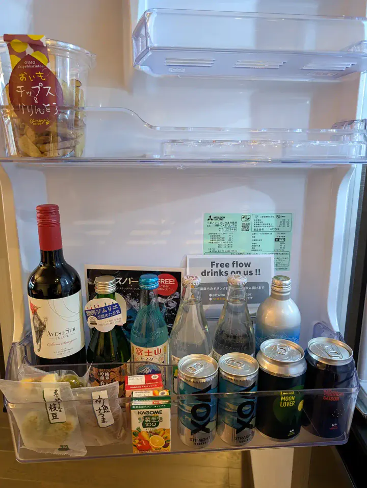 A fridge stocked with wine, beer and soft drinks