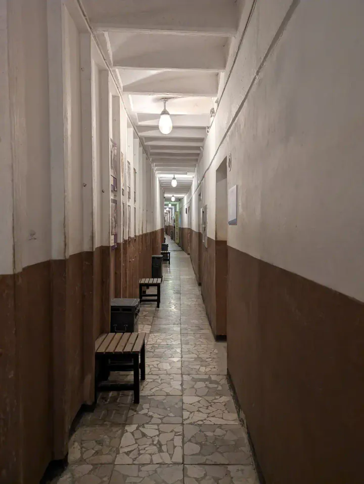 A long corridor with rooms leading off it at one of Tirana's two bunker museums