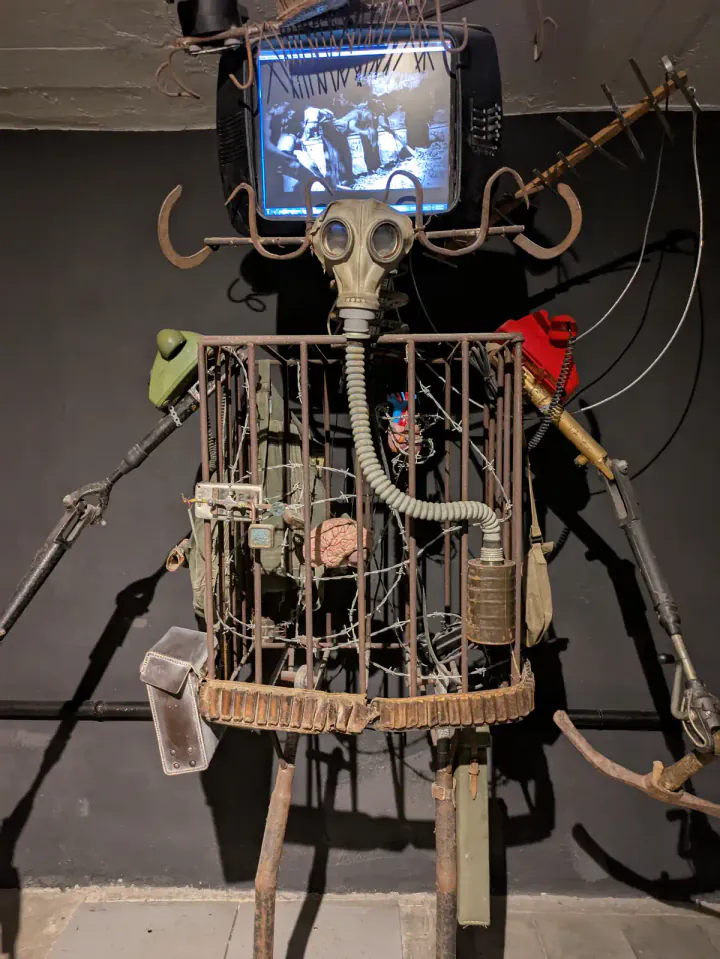 An art installation at Bunk'Art 2. A robot figure has a TV for a head.