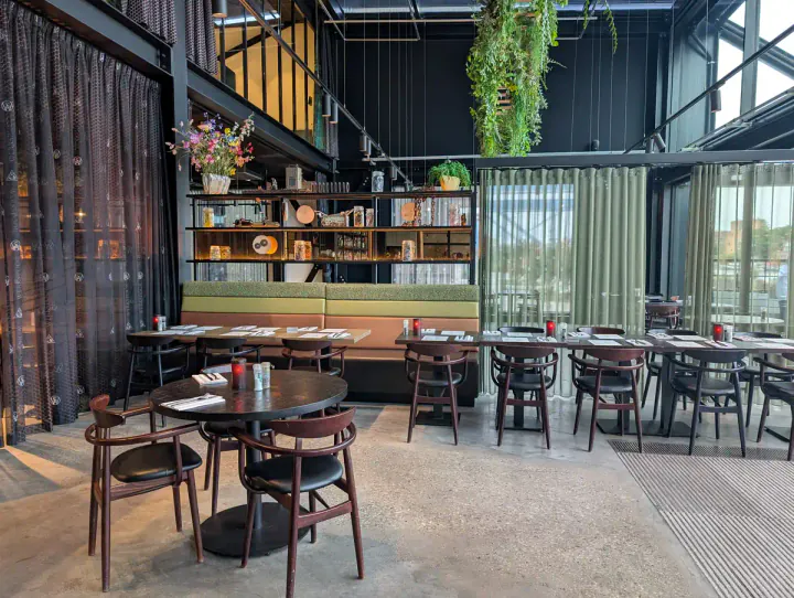 A double-height restaurant with industrial touches