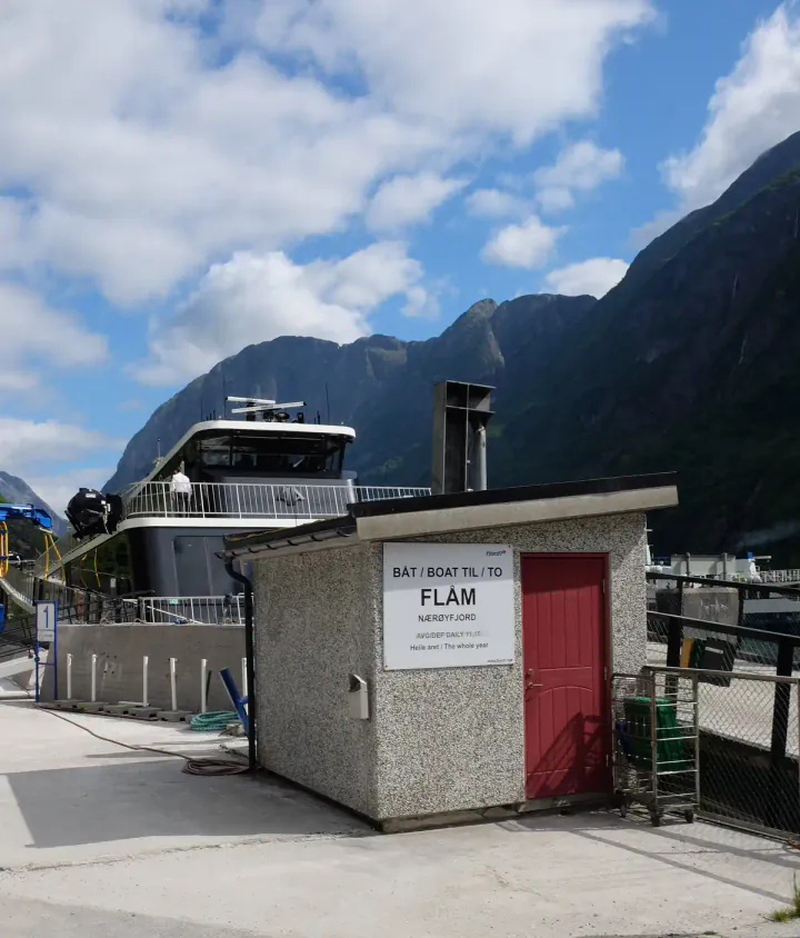 The port at Gudvangen with a sign saying to Flåm