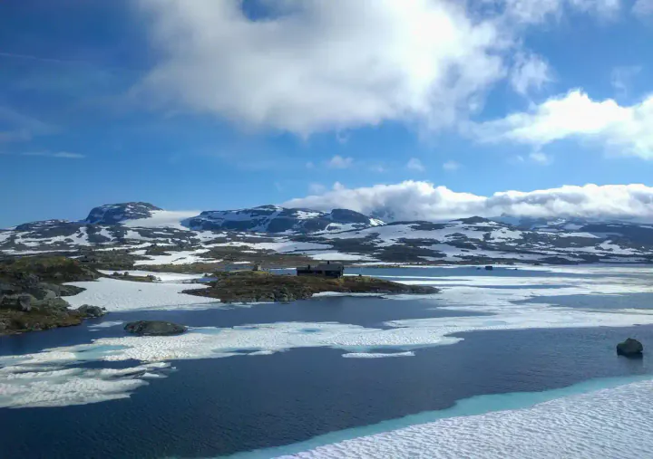 Crossing the stunning Hardangervidda plateau. Even in June it's covered in snow and ice.