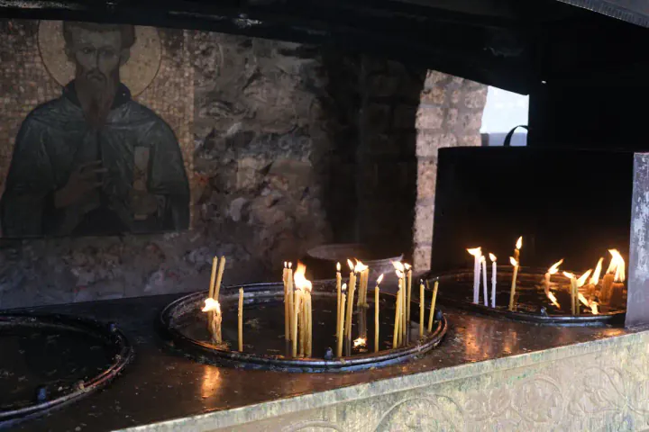 Slender prayer candles at St Naum church