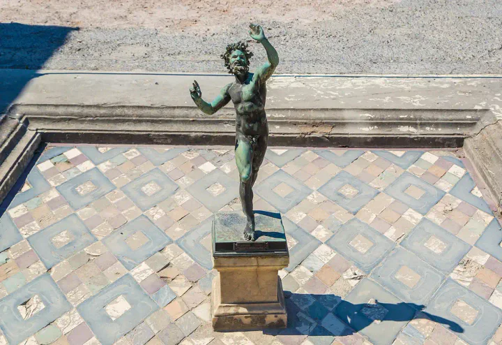 A small statue of a faun