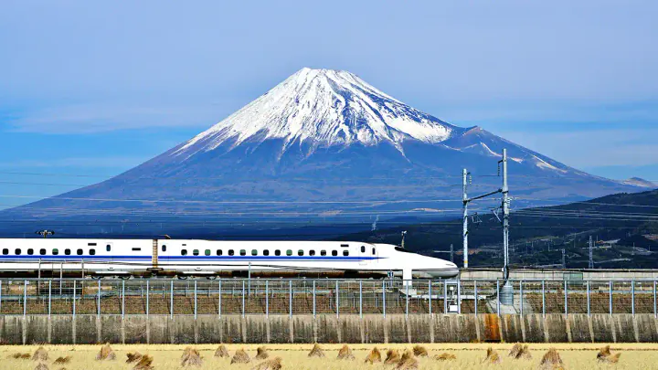 A Shinkansen passing Mount Fuji