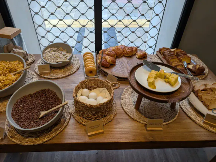 A breakfast buffet, including cakes and Spanish tortilla