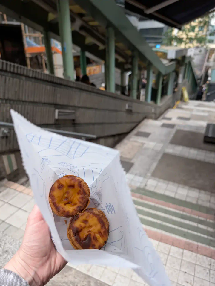 Custard tarts in a bag, next to the Central-Mid-Levels Escalators