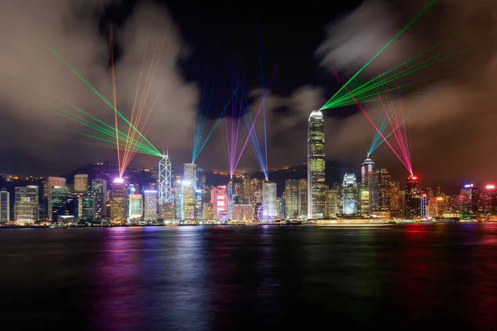 Lasers appear to shoot out of the Hong Kong skyline during the Symphony of Lights show