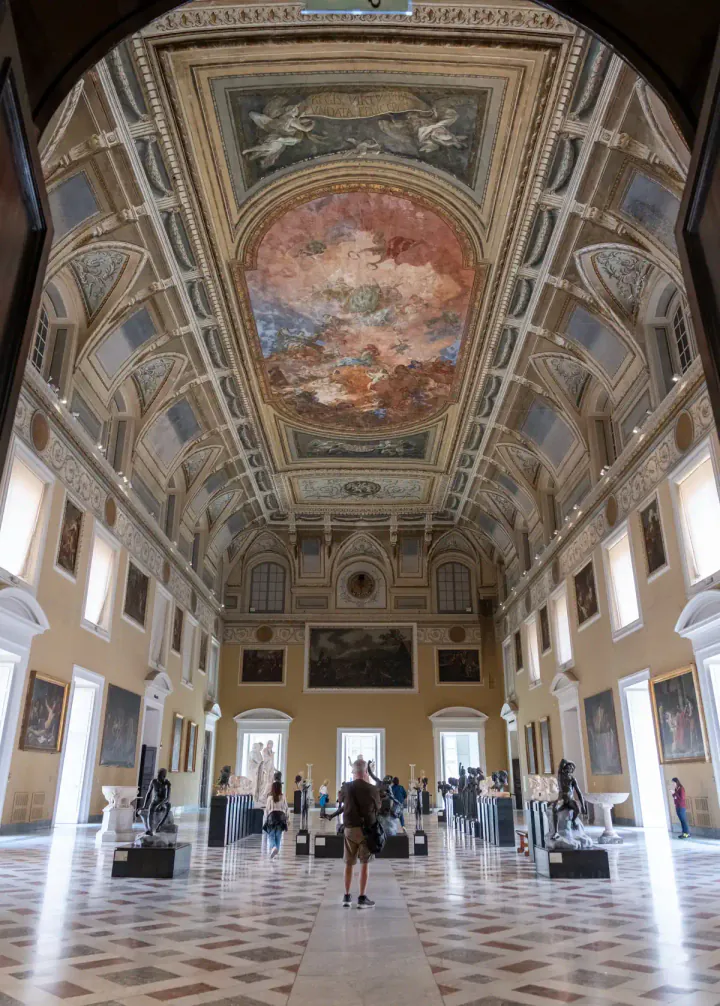 A gallery at the Museo Archeologico Nazionale di Napoli with a beautiful painted ceiling