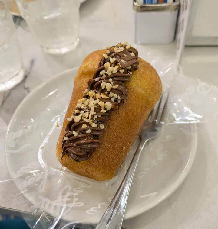 A rum-soaked Babà cake with chocolate filling