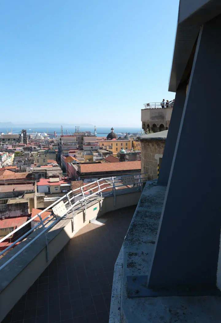 One of the walkways during the Naples Cathedral rooftop tour. There are people on a different level in the background.