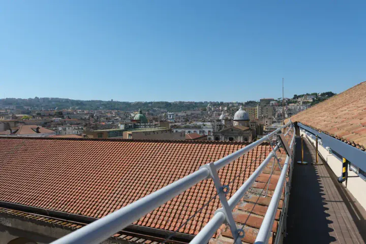 A walkway on the other side of the Duomo roof, with another dome popping out in the background