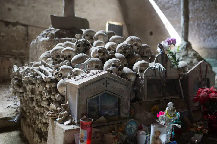 A pile of human skulls, lovingly decorated
