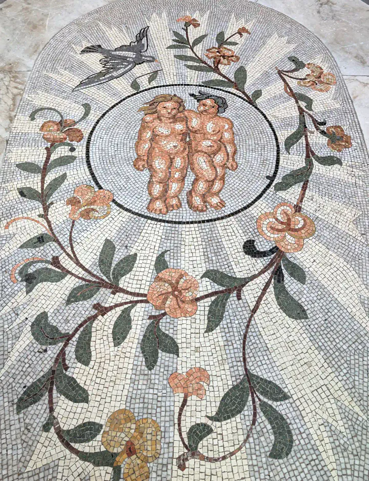 A mosaic representing the Gemini star sign on the floor of Galleria Umberto I