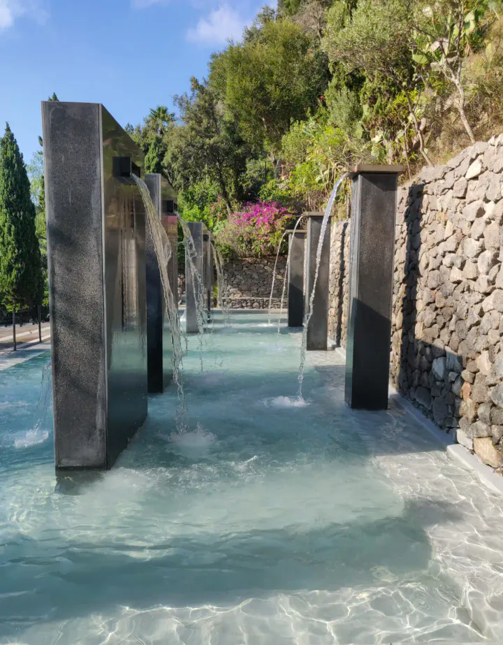 One of the treatment areas at the Negombo thermal spa in Ischia. Metal columns have spa water coming out of them like a shower.