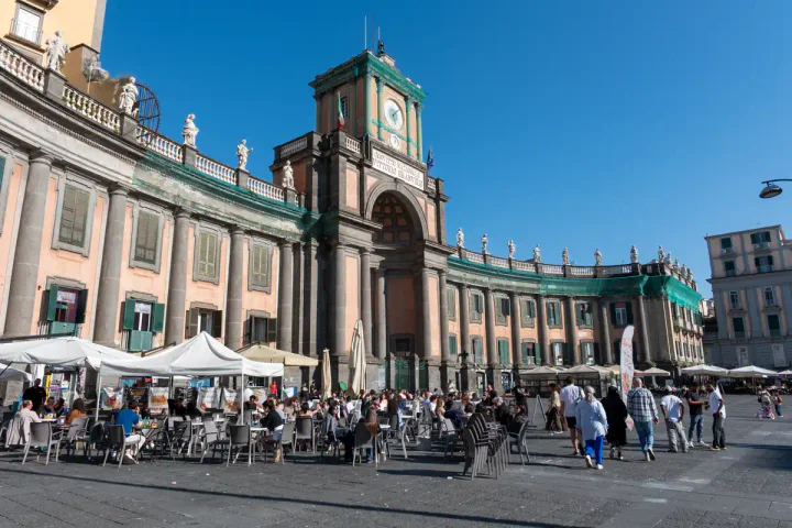 A large, curved building in a square
