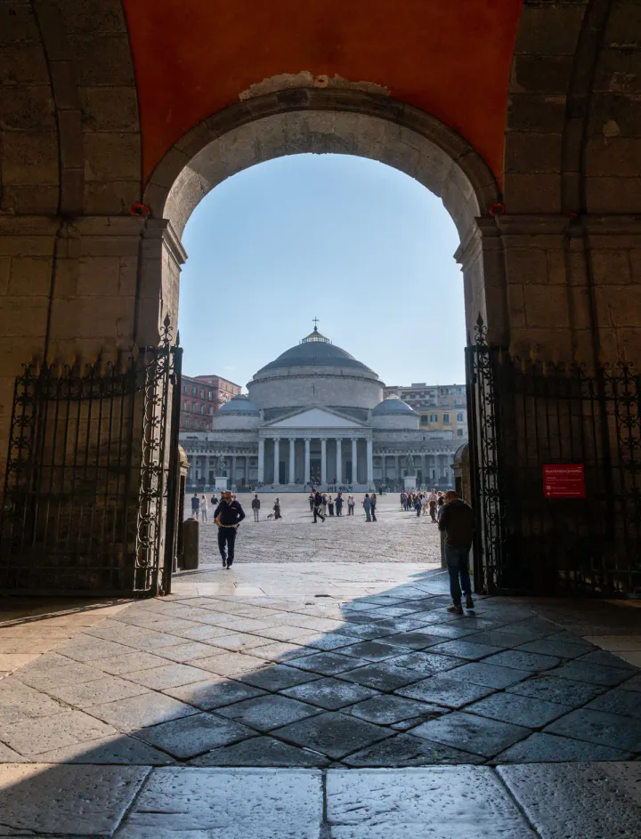 A large, domed church seen through an arch
