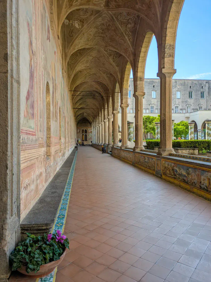 A beautiful, calm cloister with arches and richly decorated walls
