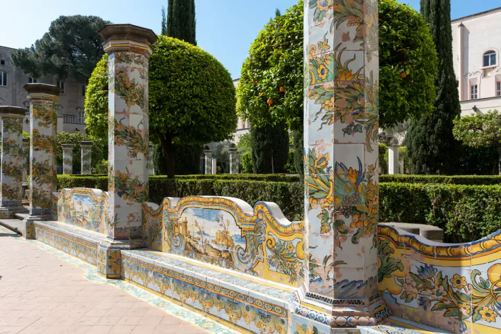 Beautifully painted tiles and citrus trees at the Santa Chiara cloister