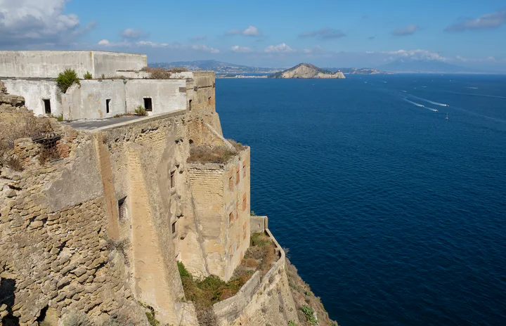 Huge fortifications built into a cliff overlooking the sea
