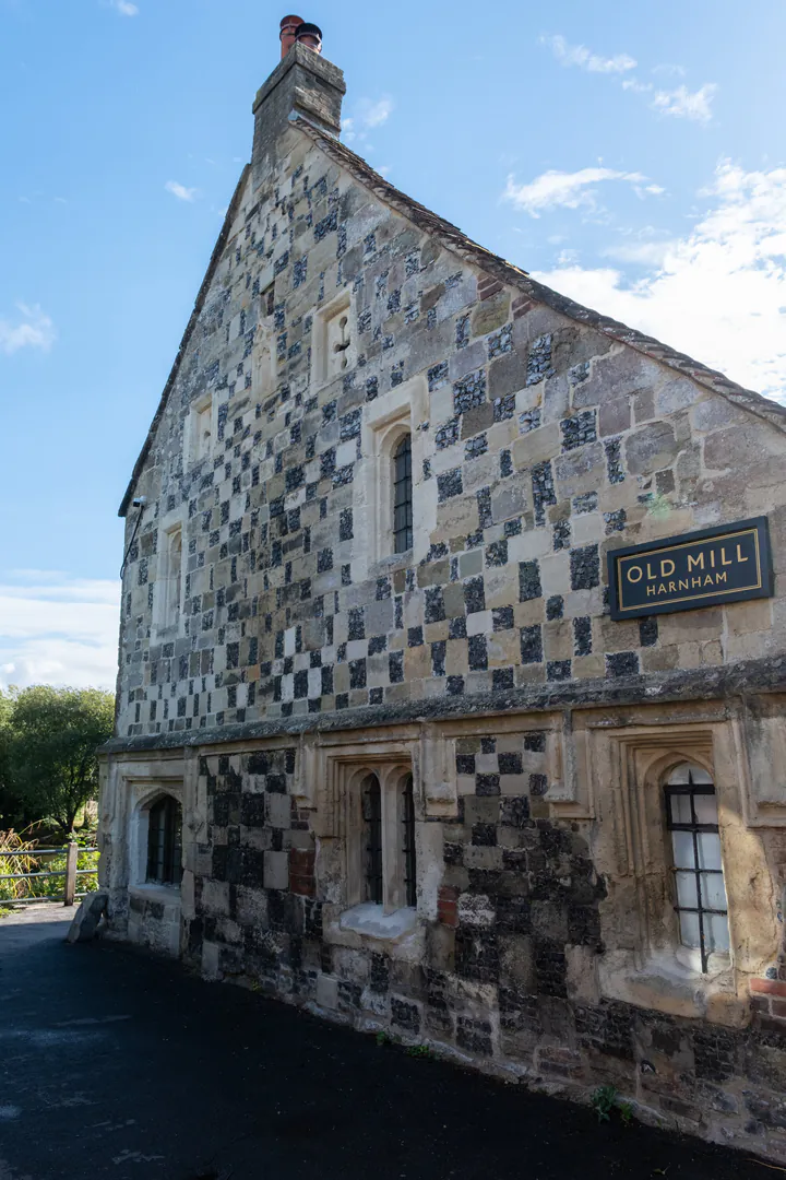 An old building with a chequered pattern on the outside
