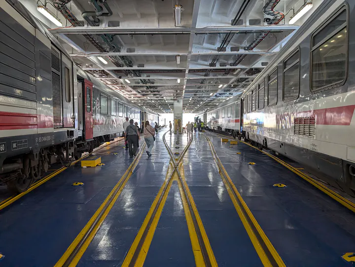 A ferry deck with two trains on board