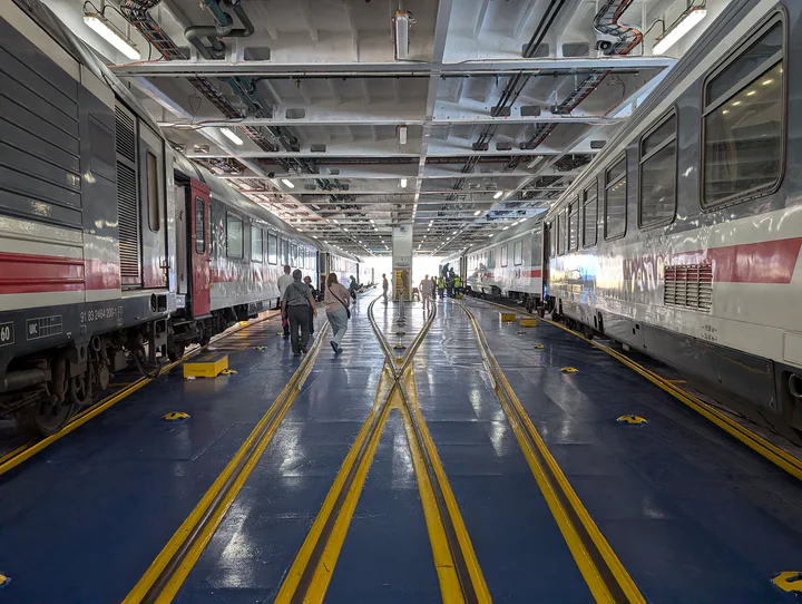 A ferry deck with two trains on board