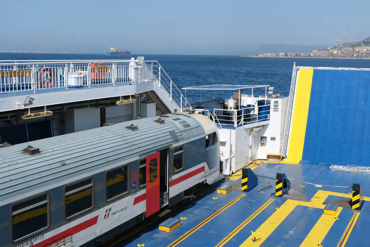 The Naples to Sicily train on a ferry in the middle of the Strait of Messina