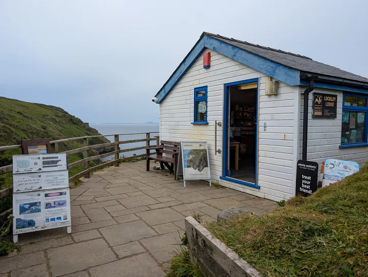 A small white building on a cliff top