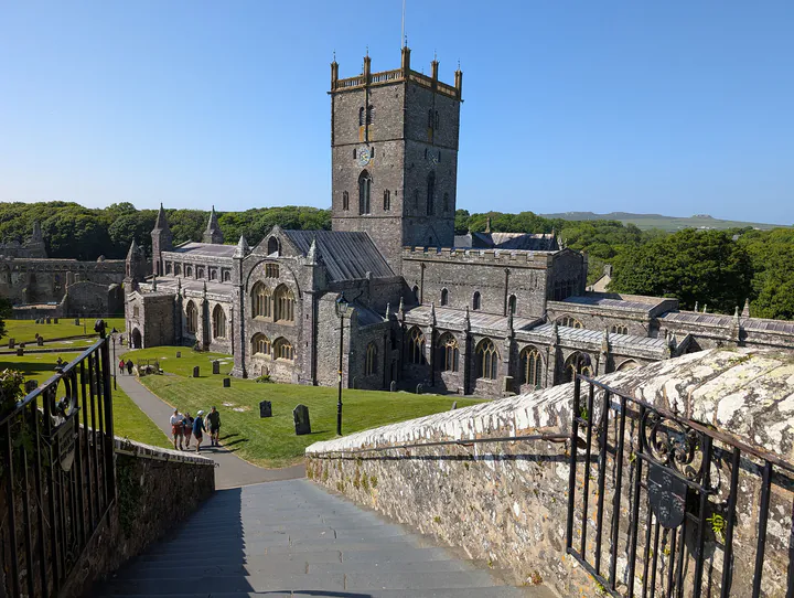 A large grey stone cathedral on a sunny day