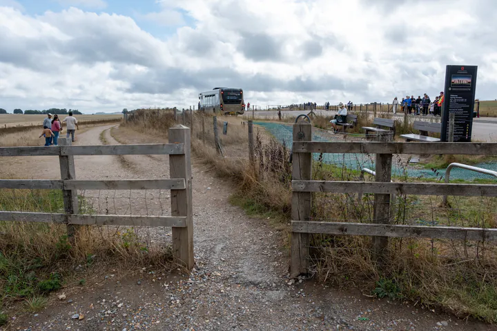 A gap in a fence marking the start of the free footpath to Stonehenge