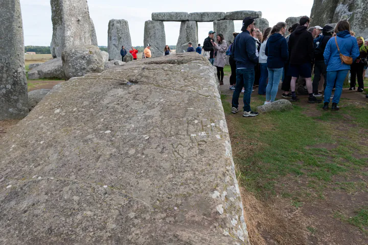A tour group inside the inner circle at Stonehenge