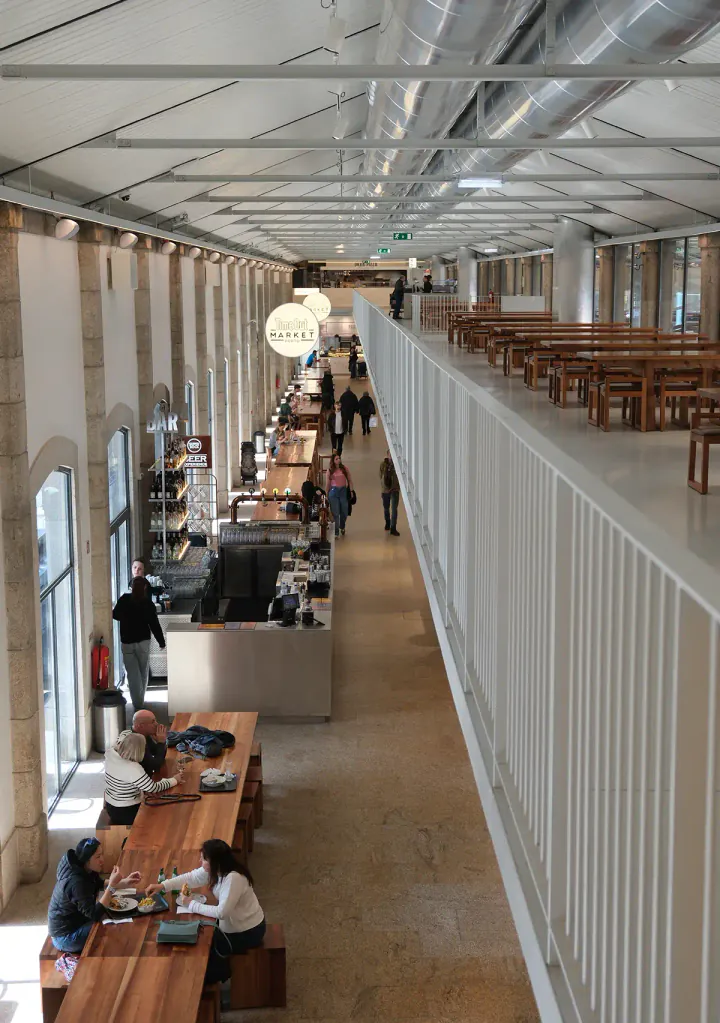 A large, airy hall with tables to eat at
