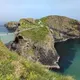 The Carrick-a-Rede rope bridge crossing high over the sea to an island