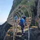 Crossing the Tubular Bridge on the Gobbins Cliff Walk
