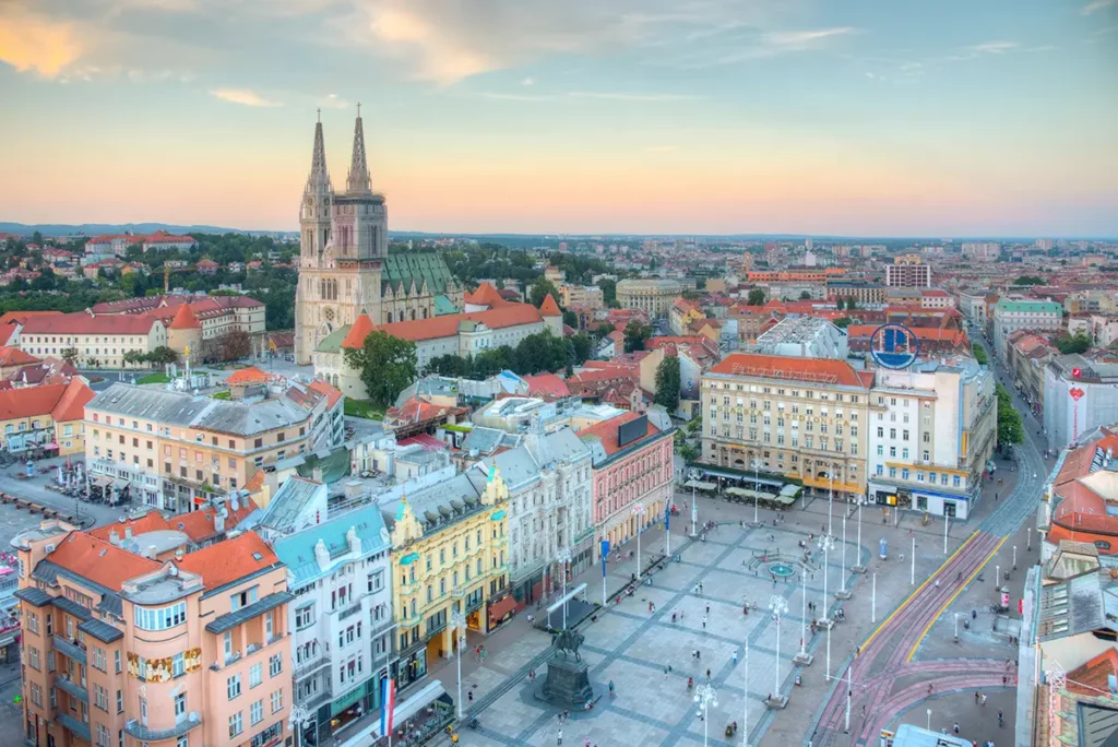 How to spend one day in Zagreb - a view of Zagreb's main square from above at sunset.