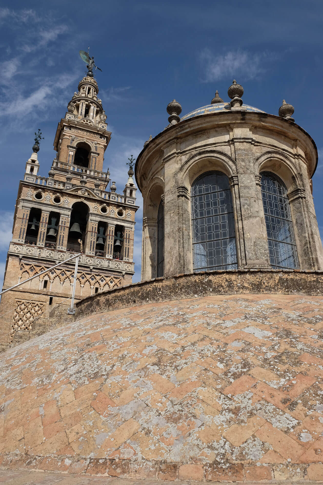 The dome of one of the cathedral's chapels and the Giralda bell tower