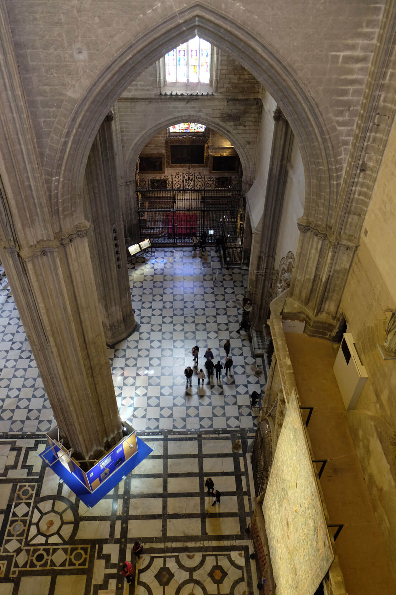 On a narrow walkway inside the cathedral