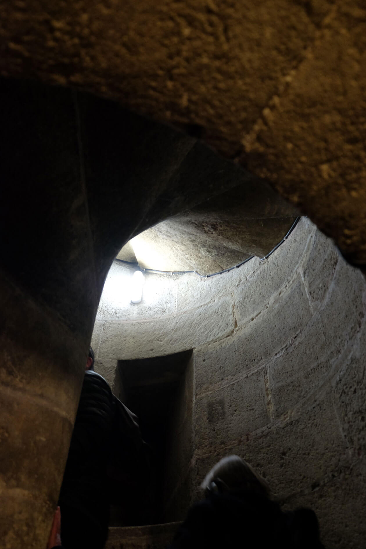 The first of many narrow spiral staircases up to the roof